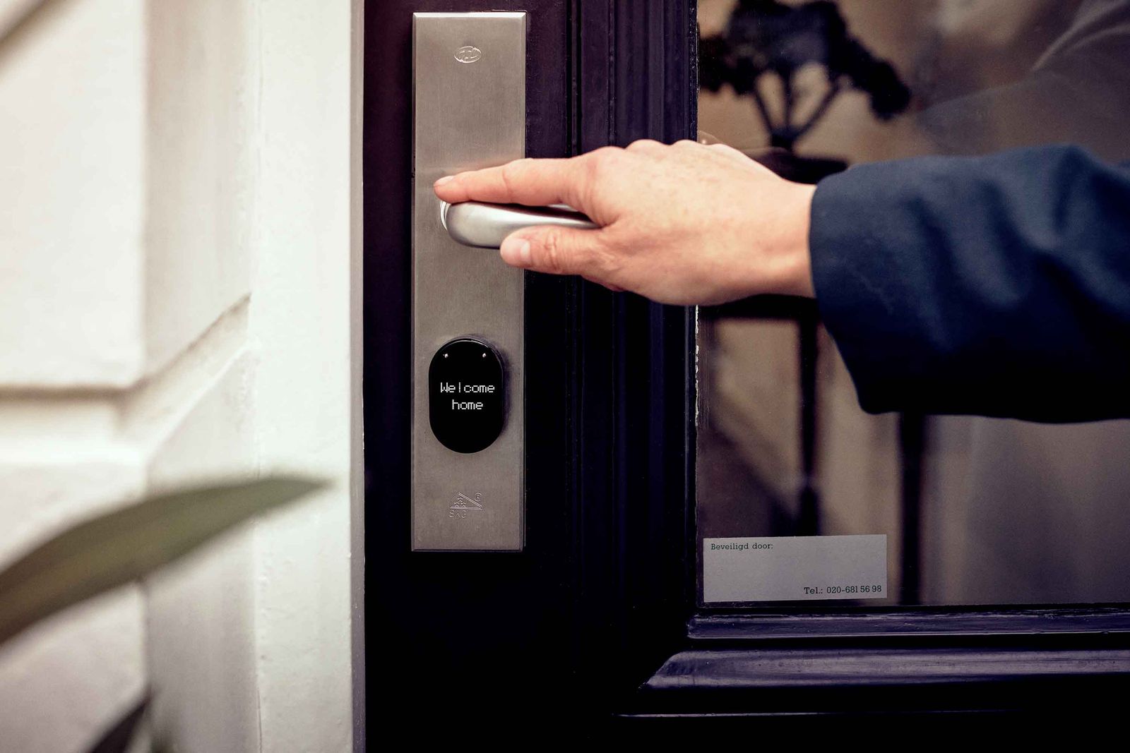 A smart deadbolt installed on a front door