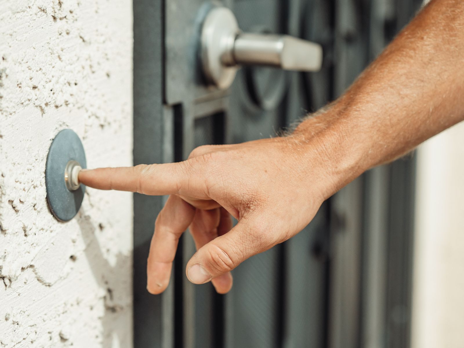 A video doorbell mounted beside a front door