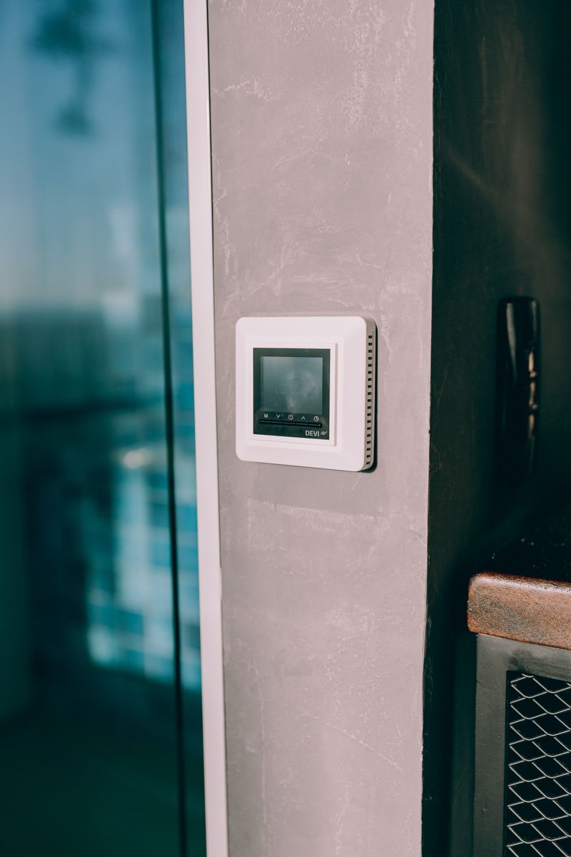 Sleek wall thermostat in a modern home