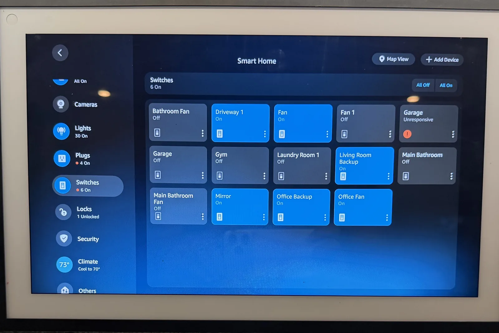 A wall mounted Echo Show 15 running a whole home, installed by our team