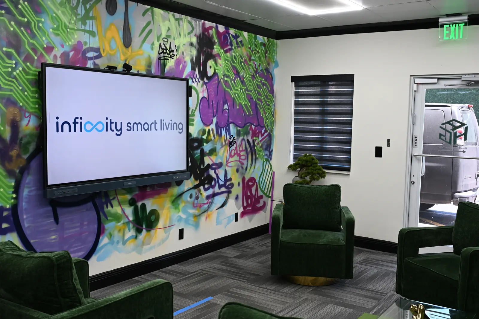 Motorized zebra shades and wall mounted display in the Infinity Smart Living office