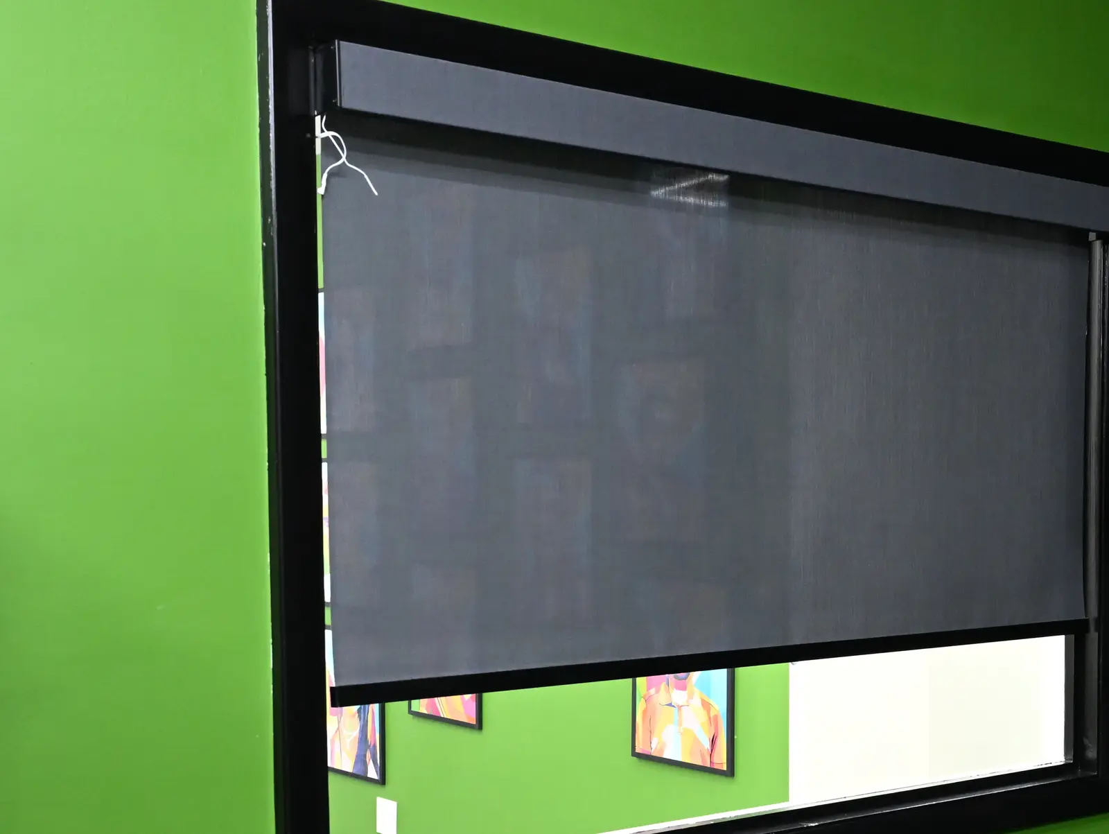 Motorised smart shades installed on large windows in a South Florida home